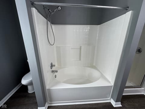 Bathroom at 13563 Guy Street, Fishers, IN — Clean updated bathroom with modern shower tub combo.