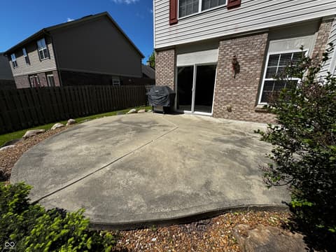 Backyard at 13563 Guy Street, Fishers, IN — Spacious concrete patio with direct backyard access.