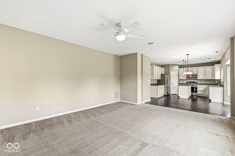 Family room at 5654 W Woodstock Trail, McCordsville, IN